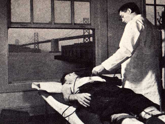 "This local 10 longshoreman is having an electrocardiograph taken to detect any heart irregularity. This is one of the many tests in the recent program conducted for the ILWU by Permanente." Planning for Health, Fall, 1951.