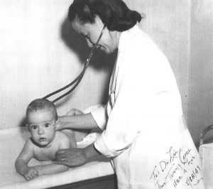 Beatrice Lei, MD, with infant patient, 1947